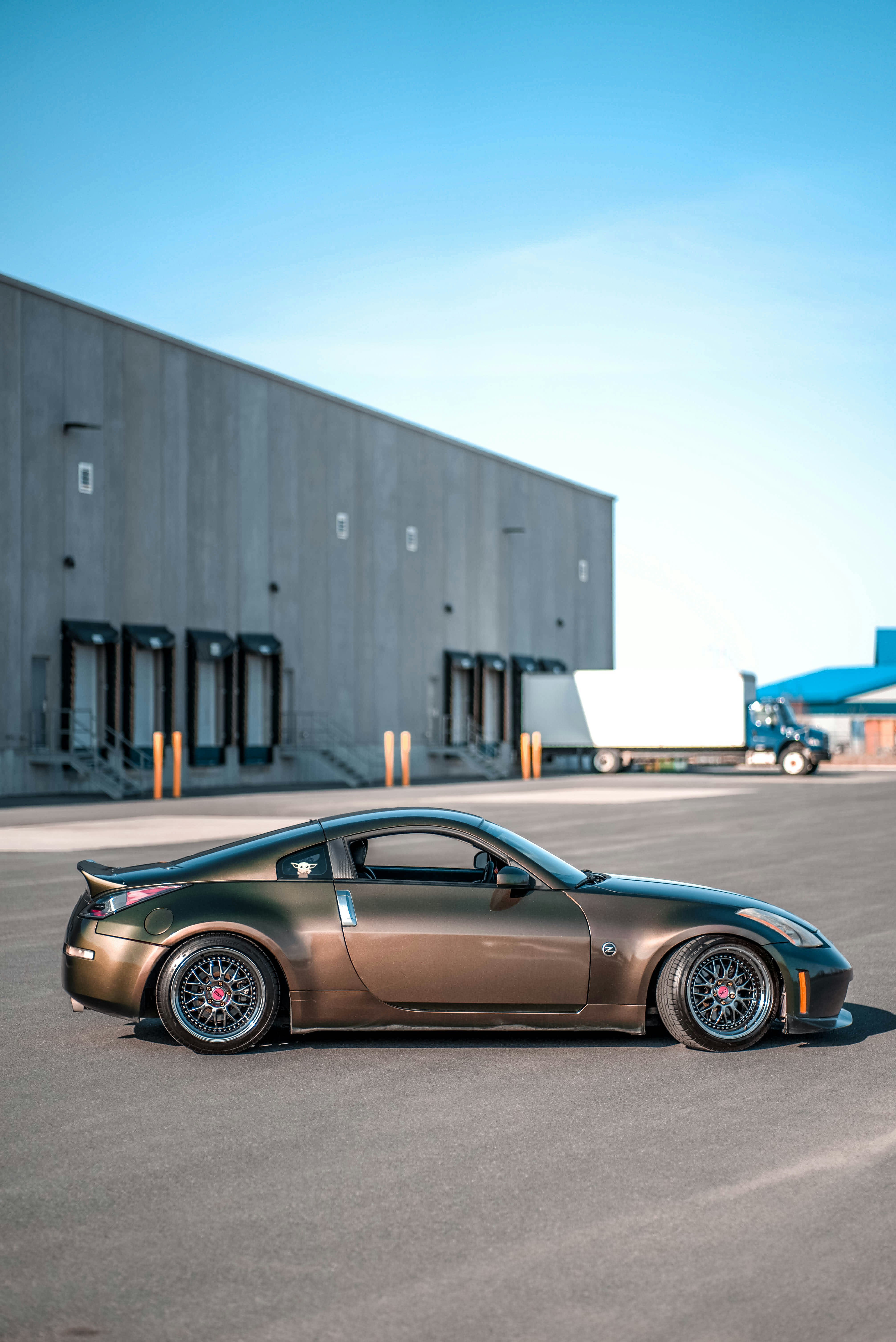 blue porsche 911 parked near white building during daytime